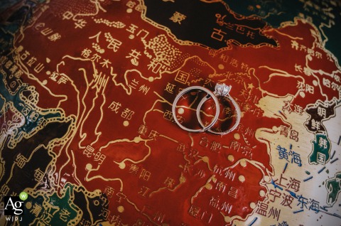 Inside a home in Kaifeng, Henan, wedding rings are carefully arranged on a map, symbolizing the couple’s journey and the places significant to their love story.