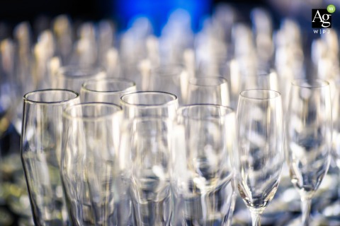Delicate wedding day details of toasting glasses are highlighted at the reception venue in Northern California, where thoughtful styling and personal touches surround the celebration.