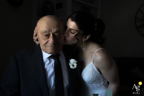 An artistic wedding portrait from Tollo, Abruzzo, Chieti, Italia, capturing a tender kiss for Nonno (grandfather) on the special day.
