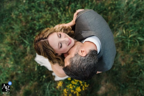 Romantic Neck Kiss: A Top-Down Wedding Portrait at Spinning Leaf, Shelby NC. Top-down view of a groom romantically kissing his bride's neck at Spinning Leaf, Shelby NC.
