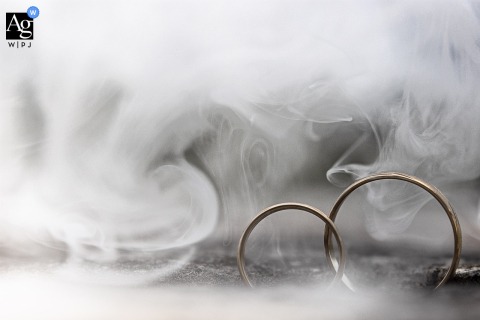 A dreamy detail shot at Château du Montalieu, France, where rings are surrounded by smoke, creating a cloud-like, ethereal effect.