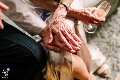 A mother and son at Salish Lodge wedding, smiling, comparing pastel nail polish.