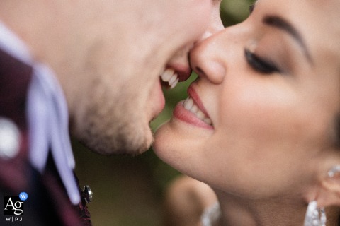 Joyful Kiss: Torino's Tenuta La Michelina Wedding Day Portrait A close-up of a couple's joyful, kissing smiles, captured at Tenuta La Michelina, Torino, Italy.