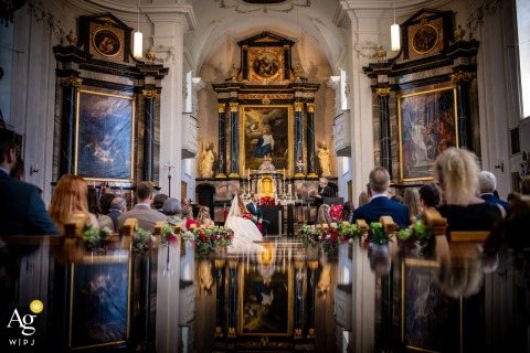 The ceremony at The Church in Adligenswil, Switzerland, reflected in a mirror below the main scene.