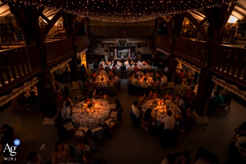 An overhead wide view of a meal set in a low-light setting at Ferme Inharria, Saint-Pée-sur-Nivelle, France.