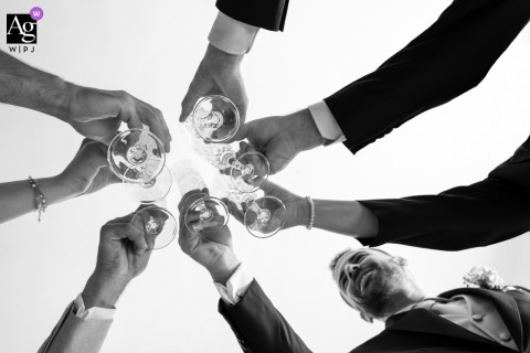 Alessandro toasts with friends and parents at home in Biella, Italy, before wedding ceremony.