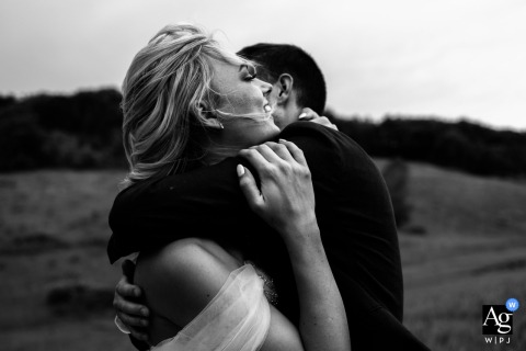 Couple embracing lovingly at Chateau Coty, Tarn-et-Garonne, France, during their romantic wedding.