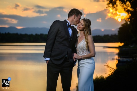 Groom kisses bride’s cheek at sunset, Fort Collins Country Club, Colorado; romantic wedding portrait.
