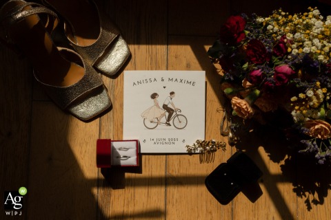 An artistic flat lay at the reception venue in Marseille, Bouches-du-Rhone, showcases the bride's wedding accessories carefully arranged on a surface within her bedroom suite.