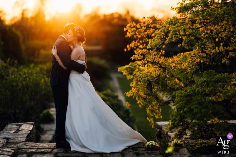 Hestercombe Gardens, Somerset: Newlyweds in a Softly Glowing Sunset Embrace Newlyweds share a quiet, romantic sunset moment at Hestercombe Gardens, Somerset, glowing softly.