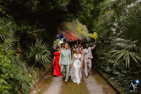 The married couple and their witnesses on a walking trail with smoke grenades in Granville.