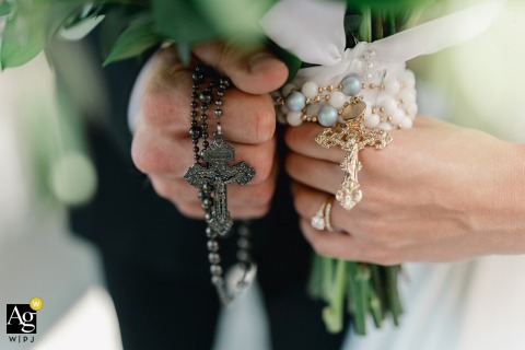 During their ceremony at St. Jerome's Catholic Church in Oconomowoc, Wisconsin, the bride and groom hold their rosaries close to their hearts.