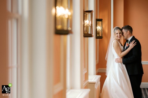 The bride and groom enjoy a quiet portrait session away from the crowd for cozy portraits inside the elegant and historic Madison Club in Madison, Wisconsin.