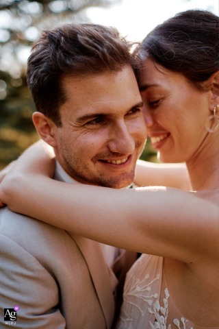 The bride and groom hugging during their couple's photoshoot at the ceremony location in Fribourg, Switzerland.
