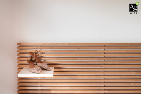 Elegant bridal shoes are showcased in a detailed still-life portrait in Udine, Italy, capturing the fine textures and sophisticated style of the bride's carefully chosen wedding footwear.