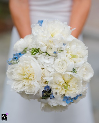 Symmetrical Bridal Bouquet of White and Blue Flowers at Top Notch Resort, VT Symmetrical detail shot of a beautiful bridal bouquet featuring white and blue flowers, held by the bride at Top Notch Resort in Stowe, Vermont.