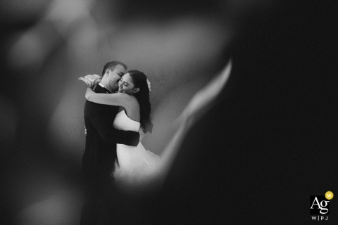 A dreamy, black and white image of the bride and groom in a loving embrace at Parma Sole.