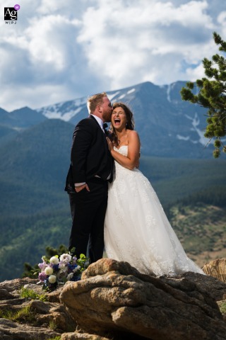 In Rocky Mountain National Park, Estes Park, Colorado, the couple's artistic portrait captures them giddy with love and the altitude right after their wedding ceremony.