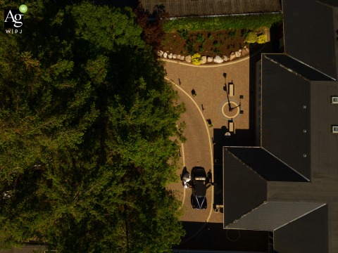 The bride and groom make a grand entrance as they arrive for their wedding reception at Harvey's Point in County Donegal, greeted by the scenic beauty of Ulster.