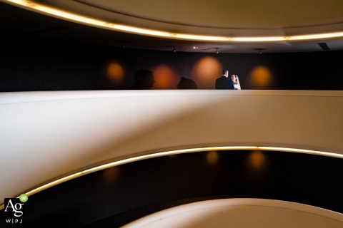 A timeless portrait of the couple is captured during their wedding reception in London, England, utilizing the sophisticated interior design of the urban venue as a polished backdrop.