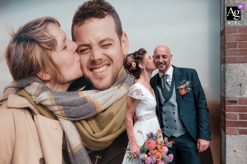 In Larmor-Plage, Britanny, the wedding couple poses across from the local church to mimic the adjacent bank advertisement for a playful, self-aware portrait.