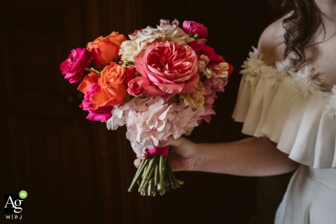 Reminiscent of a classical painting, a vibrant pop of floral color stands out against a deep, dark background in the exquisite natural light of Wyresdale Park, Lancashire.