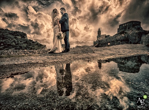 In a creative composition titled Reflections of Us, the wedding couple is mirrored in water near San Pietro in Portovenere, highlighting the historic stone architecture.
