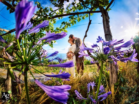 Surrounded By Wild Greenery In Campiglia Italy The Couple Poses For An Artistic Portrait Integrating Natural Environments Surrounded by the wild and lush greenery of Campiglia in La Spezia, the couple poses for an artistic portrait that integrates the natural Italian environment into their celebration.