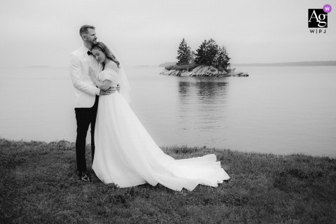 Harpswell, Maine — The couple stands together in the fog on their wedding day, captured in black and white for a dreamy, vintage-inspired portrait with nostalgic atmosphere.