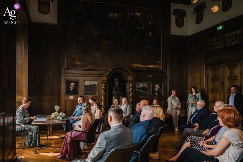 A dramatic, wide-angle view of the civil wedding ceremony hall in Wetter, Germany, showcases the grand architecture and quiet anticipation.