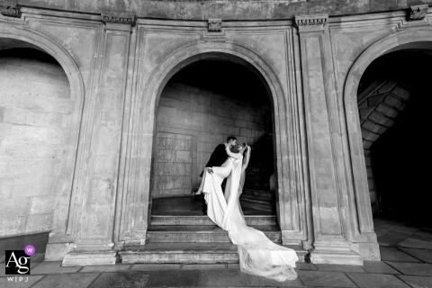 In La Alhambra Granada Spain Couple in Stone Architecture Black and White La Alhambra, Granada, Spain — The couple is captured in black and white among the old world stone architecture, creating a timeless and romantic wedding portrait at this historic landmark.