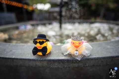 At Clos de Florie in Savoie, France, a whimsical wedding detail shows the newlyweds represented as charming miniature bride and groom duck figurines, positioned side-by-side.