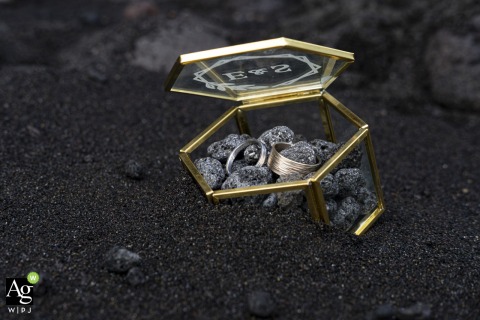 Simone and Emanuela’s wedding rings rest inside a box of lava rock on the black volcanic sands of Piscita Beach, resembling a treasure chest on Stromboli.