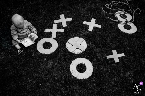 An artistic black and white detail from Weingut Hahn, Alzey, highlights the graphic X's and O's spread on the lawn played with by the wedding party's young guests.