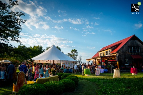 Guests gather for cocktail hour under and around a large reception tent at the Sperlak Gallery in Cape May, New Jersey, during an artistic photographer’s session.