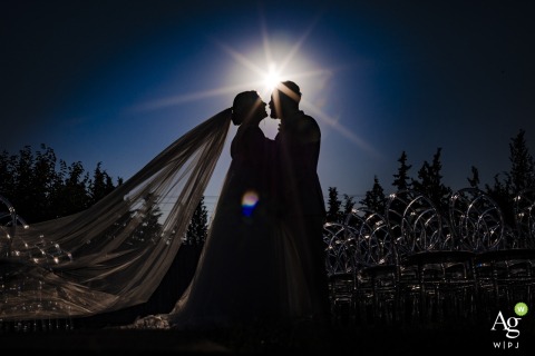 A striking backlit portrait showcases the couple in a glow of light at Bodrum Flamm, capturing the romantic atmosphere of their wedding celebration in Istanbul, Turkey.