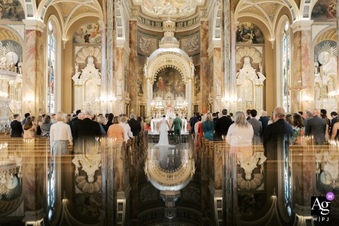 Basilica of Saint Josaphat, Milwaukee, Wisconsin,'s stunning architectural details and soaring ceiling create a majestic and artistic scene setter for the couple's wedding day.