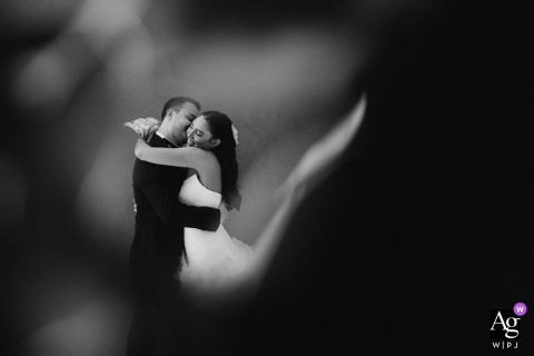 Parma Sole — The bride and groom share a free, heartfelt embrace in a black-and-white portrait, creating an ethereal and dreamy wedding image filled with emotion.