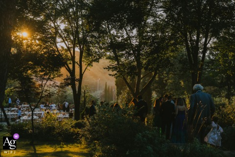 An artistic photograph creates a moody scene-setter at Casa Lavanda, highlighting the wedding's location with a subtle view of a couple walking toward the event.