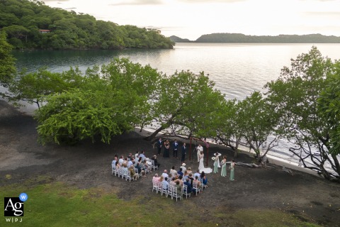 Aerial image captures a pristine wedding ceremony setup contrasting with the lush green hillside and deep blue waters of the Gulf of Papagayo at Secrets Papagayo Costa Rica, Liberia - Guanacaste.