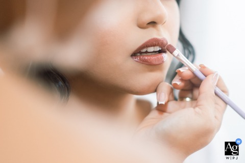 The wedding day in Maceió - AL inspired this close-up artistic photograph focusing on the subtle texture and rich hue of the bride's elegant, freshly applied lipstick.