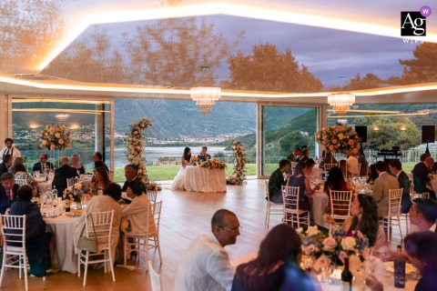 Villa Dolceacqua, Oggiono, Lake Como, Italy: The elegant dining room at Villa Dolceacqua near Lake Como, Italy, is a serene space featuring tables and large windows framing the beautiful Italian landscape.