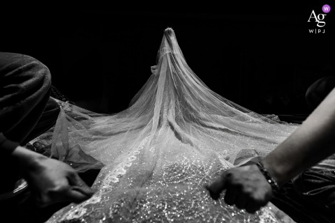 Inside A Hotel In Fujian, China, Wedding Preparations Set The Stage For The Bride’s Anticipated Entrance Inside a hotel in Fujian, China, the scene is set for the bride’s entrance as final preparations take place, highlighting the anticipation and detail of the day.