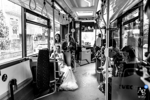 Bride And Friends Ride A Public Bus In Forlì, Italy, Traveling To The City Council For Her Wedding A bride and friends ride a public bus in Forlì, Italy, heading to the City Council for her wedding.
