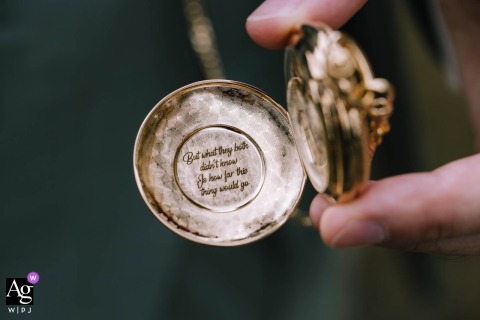 At Gut Ahe In Sauerland, Germany, A Close-Up Of The Groom’s Engraved Pocketwatch Offers A Meaningful And Personalized Wedding Detail At Gut Ahe in Sauerland, Germany, a close-up displays the groom’s watch, engraved with a personal quote, offering a meaningful wedding detail.