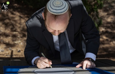 Rabbi Signs Ketubah at Congregation Etz Chaim in Marietta Georgia in Formal Wedding Rituals At Congregation Etz Chaim in Marietta, Georgia, the rabbi signs the ketubah as part of the formal wedding rituals before witnesses.