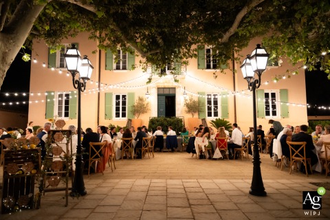 Outdoor Dinner Service Begins Under Stars at Château des Anglades in Hyères France Dinner service begins outdoors at Château des Anglades in Hyères, France, as guests gather under the stars for the evening meal.