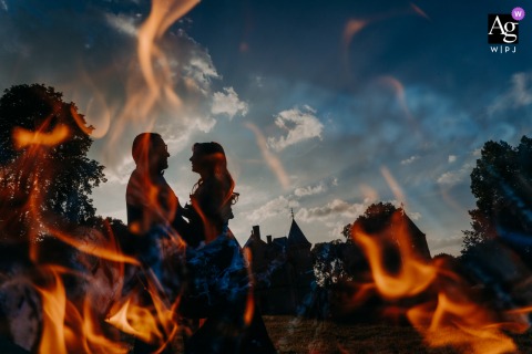The Scene At Chateau De La Beuvriere Is On Fire, Capturing Dynamic Energy And Refined Wedding Ambiance The scene at Chateau de la Beuvriere is called "On Fire," capturing the dynamic energy and refined ambiance that characterize this wedding at a grand French estate.