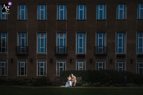 At Their Ceremony In London, The Couple Poses For A Formal Portrait In An Elegant And Refined Wedding Setting After their ceremony in London, the couple poses for a formal wedding portrait, the location’s elegant setting bringing refinement to the image.