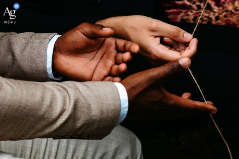 At Domaine de Gavaudun In Lot-et-Garonne, The Exchange Of Rings Ceremony Invites Guest Participation For A Shared Celebration Scene At Domaine de Gavaudun in Lot-et-Garonne, the exchange of rings ceremony invites guests to participate, passing the rings among everyone to create a sense of shared celebration.